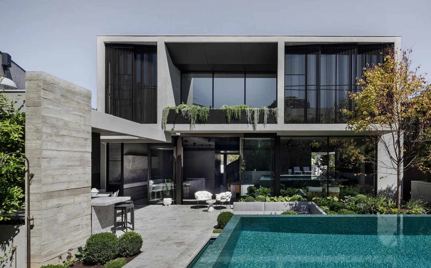 Contemporary Melbourne home exterior with streak-free glazing and poolside entertaining area